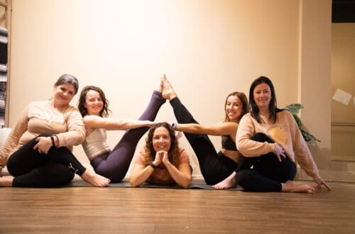 Beginner yoga students learning with props at Balanced Planet Yoga in Marlton, NJ