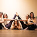 Beginner yoga students learning with props at Balanced Planet Yoga in Marlton, NJ